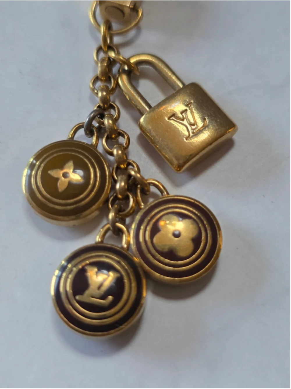 Louis Vuitton Gold-Tone Monogram Lock & Charm Phone Strap